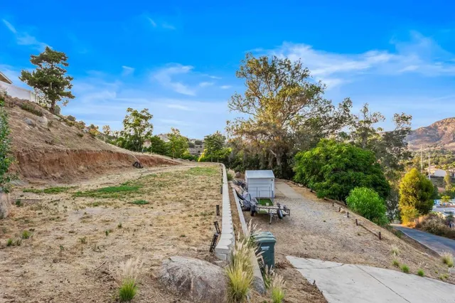 a view of a backyard with sitting area