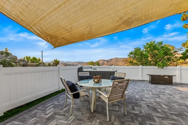 a view of a chairs and table on the terrace