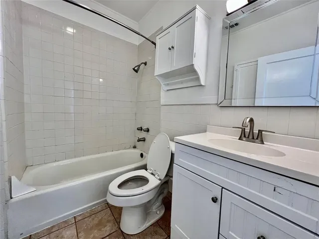 a bathroom with a sink a toilet and a bathtub