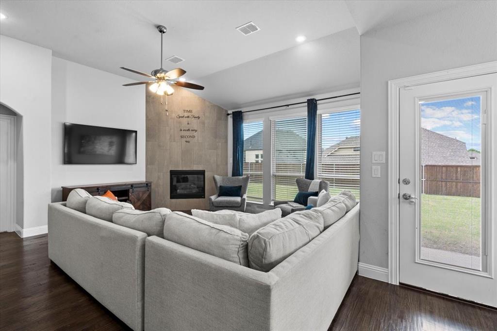 620 Shadow Trail Frisco, TX 75033 - Photo 10 of 36 Open concept living area featuring wood-finish flooring and a ceiling fan with integrated lighting