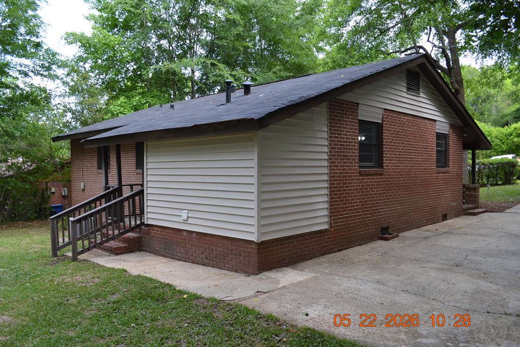 5552 Valleybrook Road Columbus, GA 31907 - Photo 23 of 27 a small barn with a small yard and a large tree
