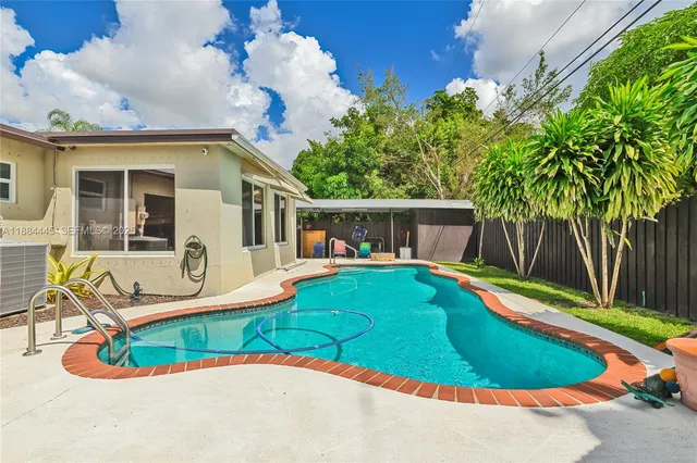 a house view with a swimming pool