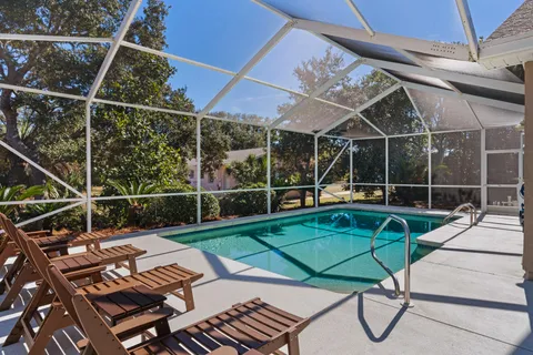 a view of a backyard with sitting area
