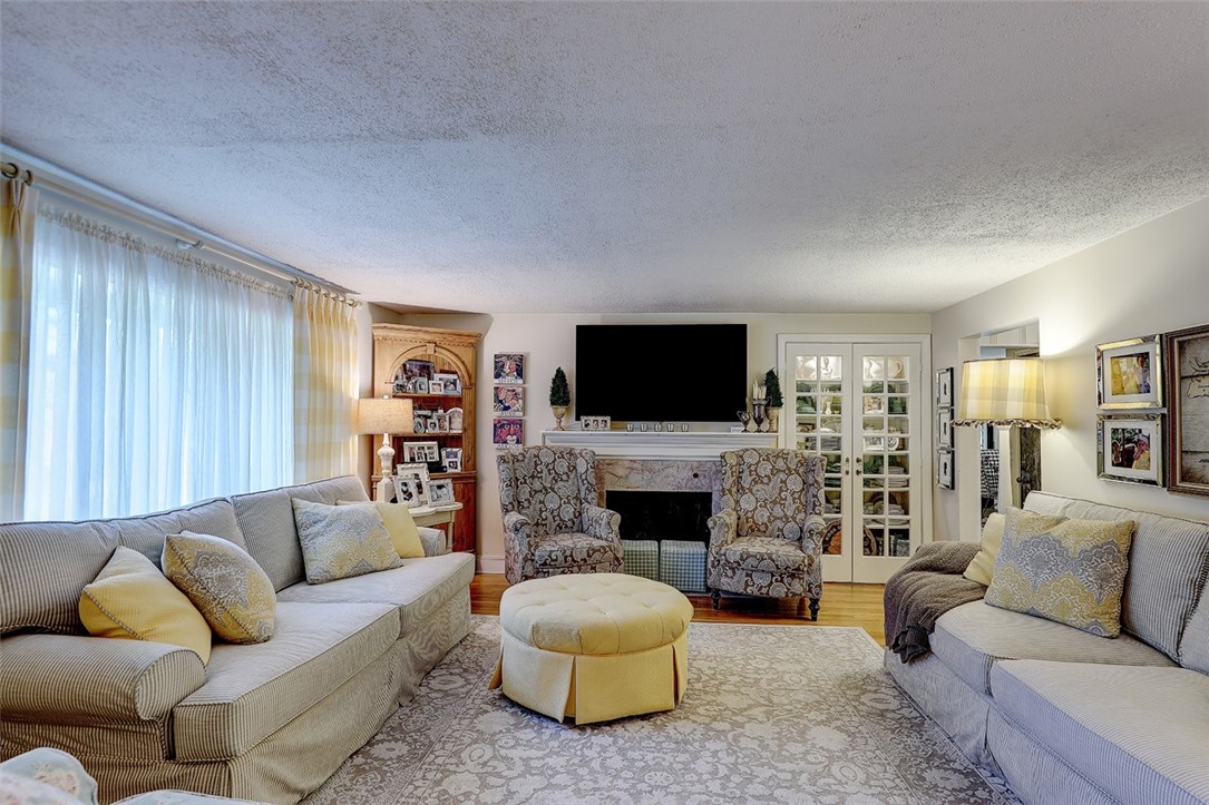 2894 Mendon Road Cumberland, RI 02864 - Photo 16 of 39 Family Room. Large window faces front of house. Working fireplace. Built in cabinets.