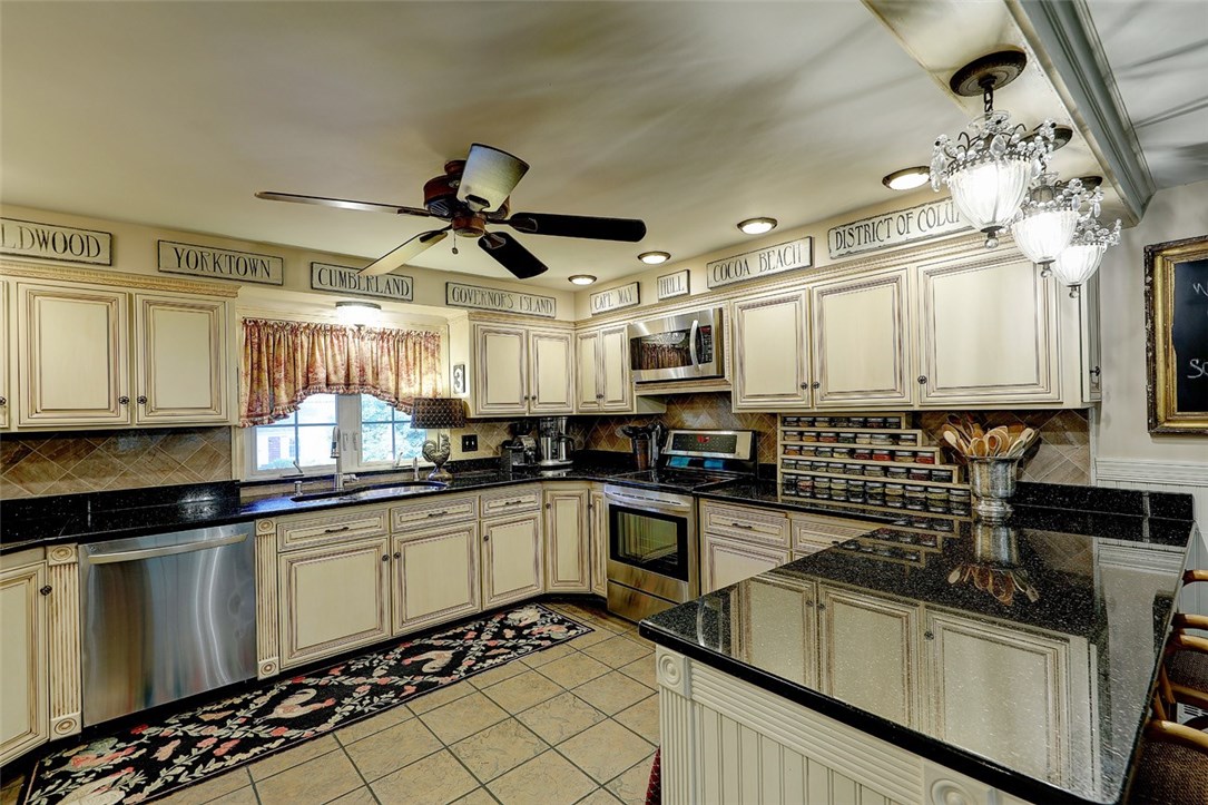 2894 Mendon Road Cumberland, RI 02864 - Photo 21 of 39 Kitchen with granite counter tops, stainless steel appliances. Window facing the front yard.