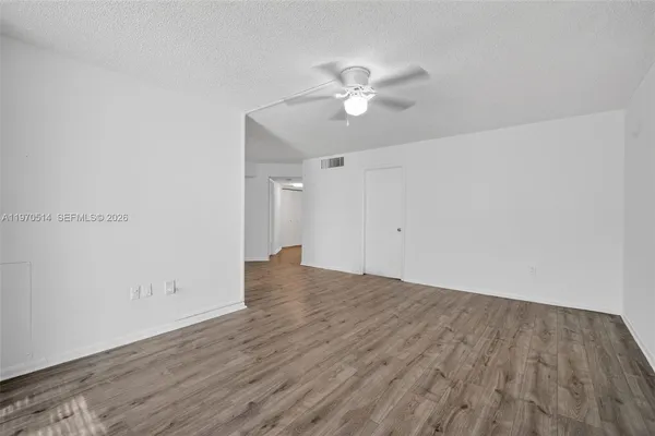 a view of wooden floor in an empty room