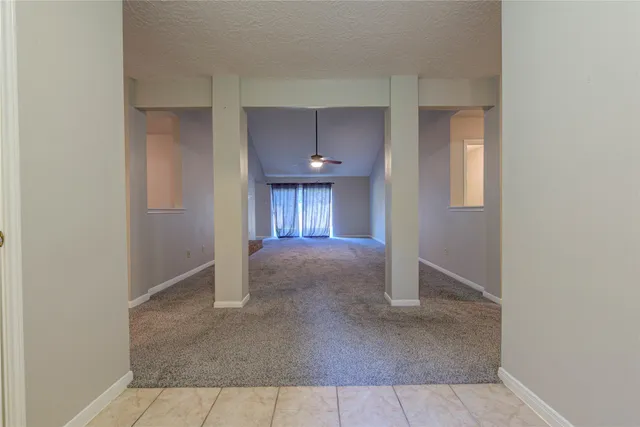 a view of an empty room and window