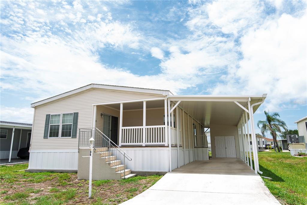 36 Freeman Avenue Punta Gorda, FL 33950 - Photo 1 of 27 a front view of a house with garden