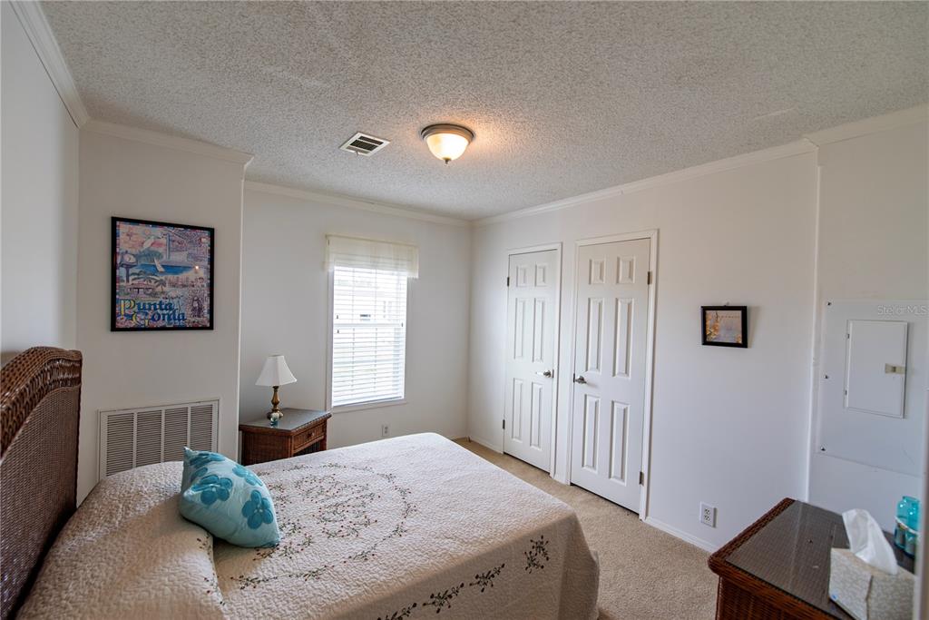 36 Freeman Avenue Punta Gorda, FL 33950 - Photo 14 of 27 a bedroom with a bed and a window