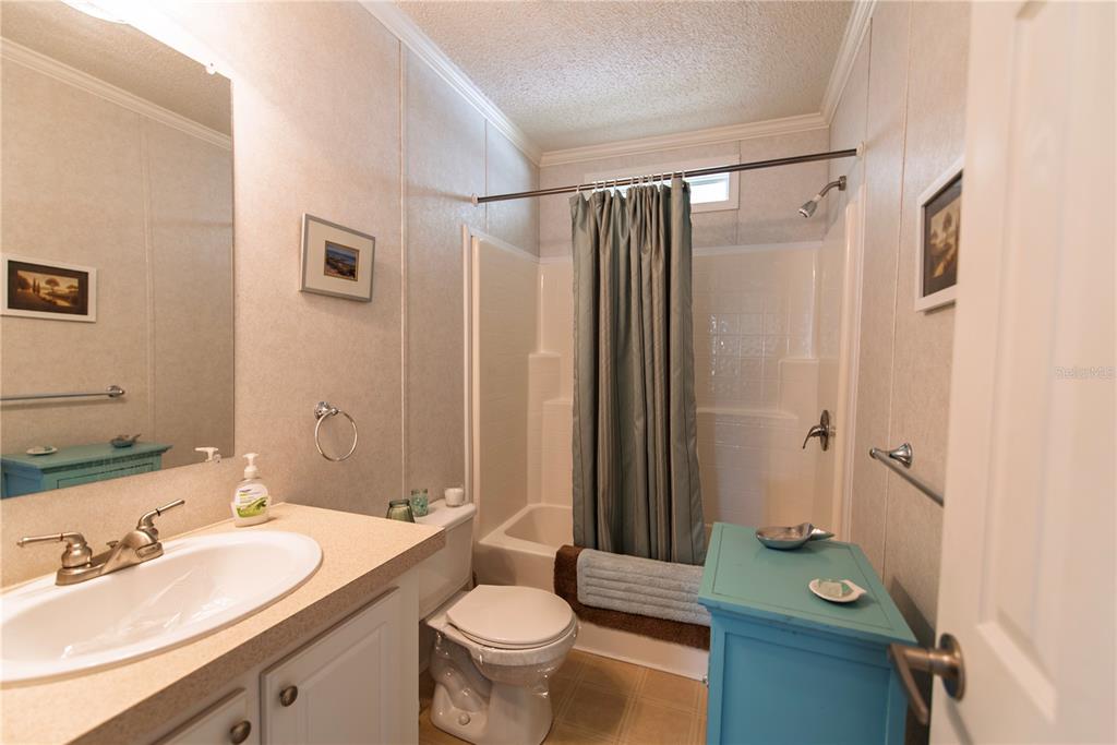 36 Freeman Avenue Punta Gorda, FL 33950 - Photo 15 of 27 a bathroom with a granite countertop sink toilet and shower