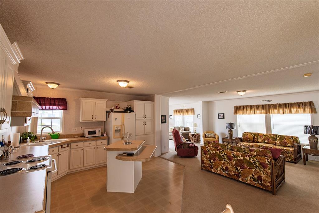 36 Freeman Avenue Punta Gorda, FL 33950 - Photo 2 of 27 a living room with furniture and a large window