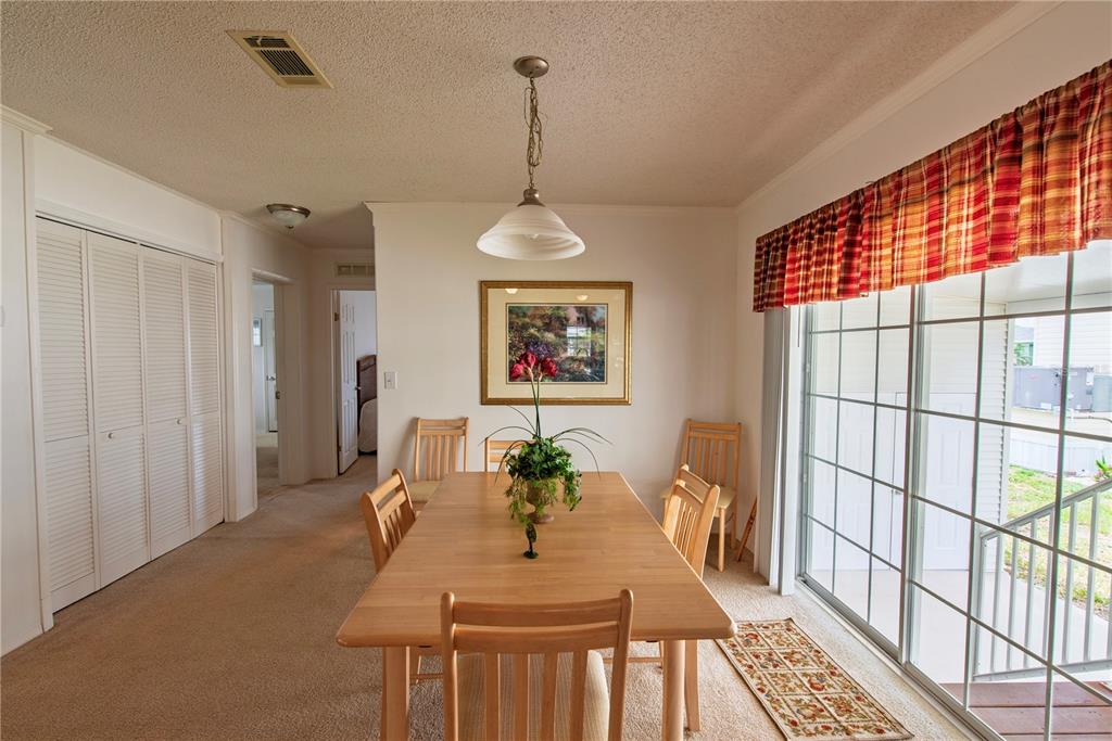 36 Freeman Avenue Punta Gorda, FL 33950 - Photo 3 of 27 a view of a dining room with furniture window and wooden floor