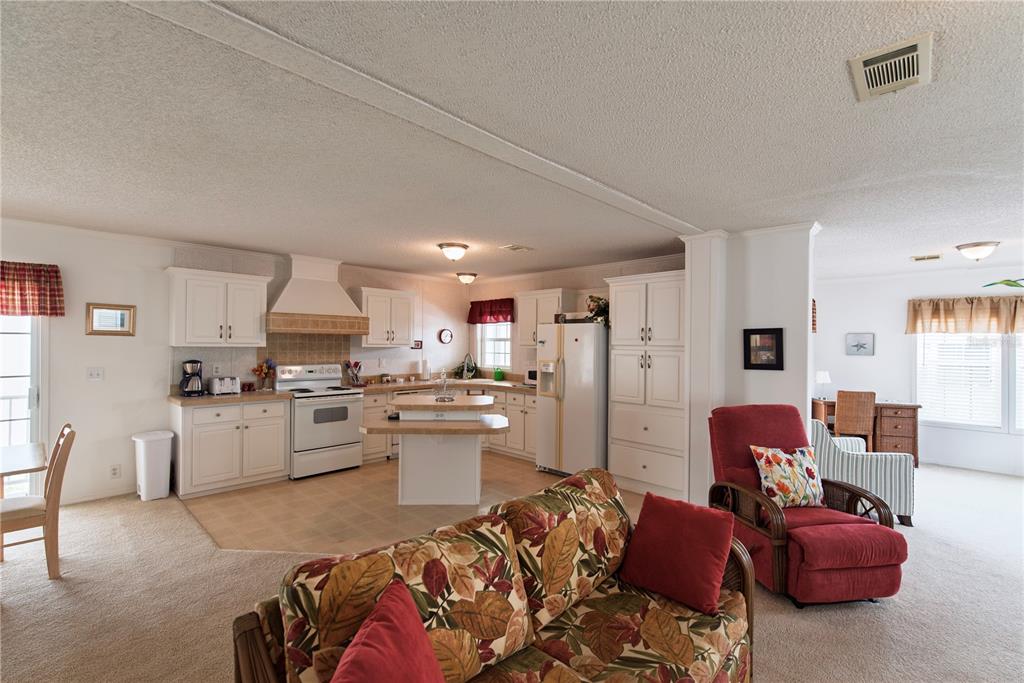 36 Freeman Avenue Punta Gorda, FL 33950 - Photo 6 of 27 a living room with furniture kitchen view and a couch