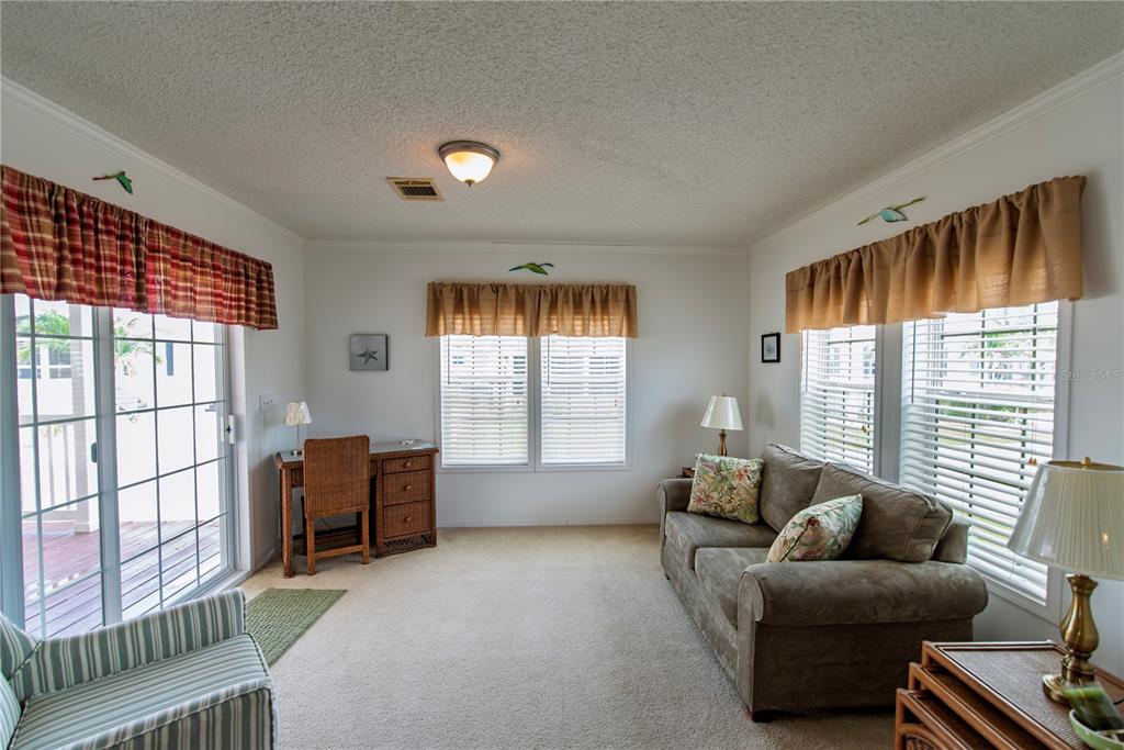 36 Freeman Avenue Punta Gorda, FL 33950 - Photo 8 of 27 a living room with furniture and a window