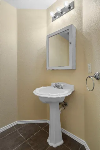 a bathroom with a sink and mirror