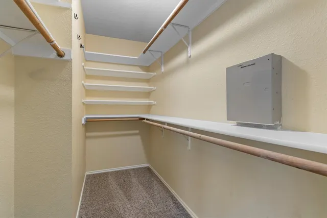 a view of an empty walk in closet