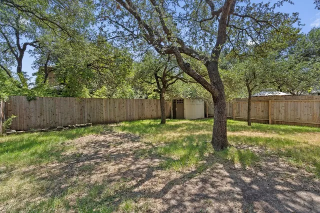 a backyard of a house with lots of green space