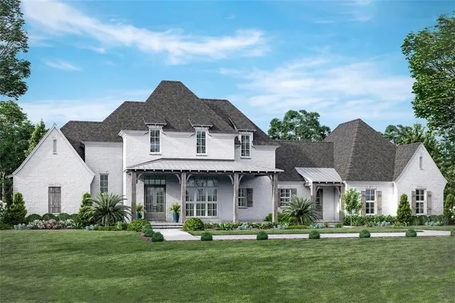 a front view of a house with a garden