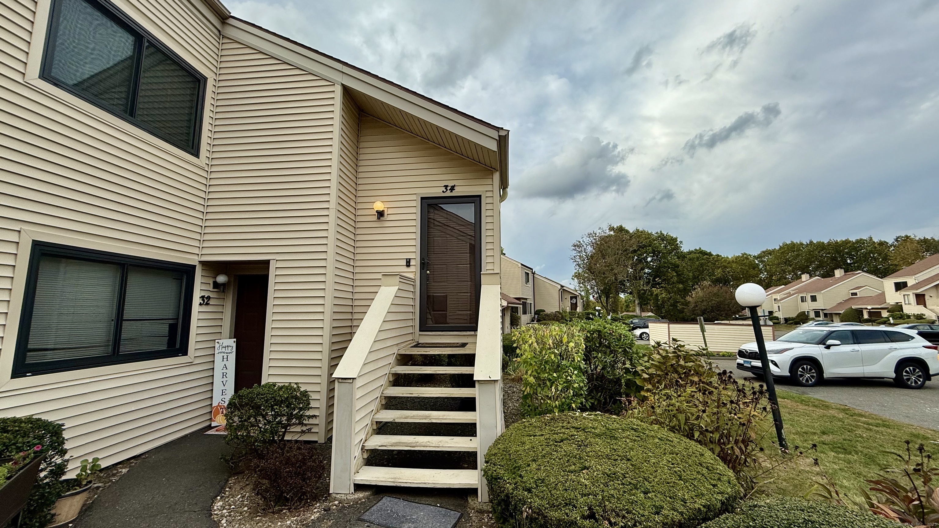 34 Nature View Trail, Unit 34 Bethel, CT 06801 - Photo 2 of 19 a view of a house with a yard