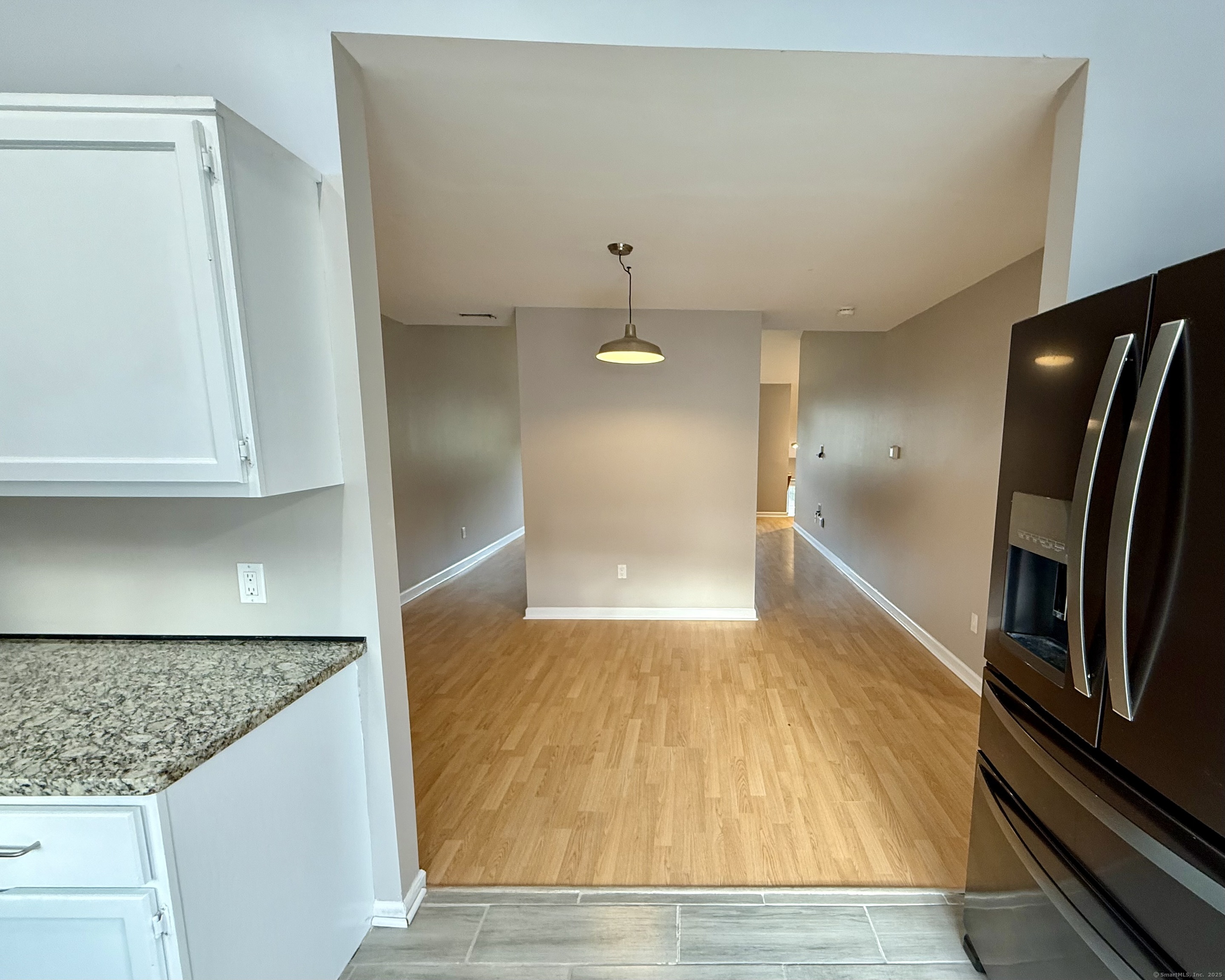 34 Nature View Trail, Unit 34 Bethel, CT 06801 - Photo 7 of 19 a view of a refrigerator in kitchen and an empty room