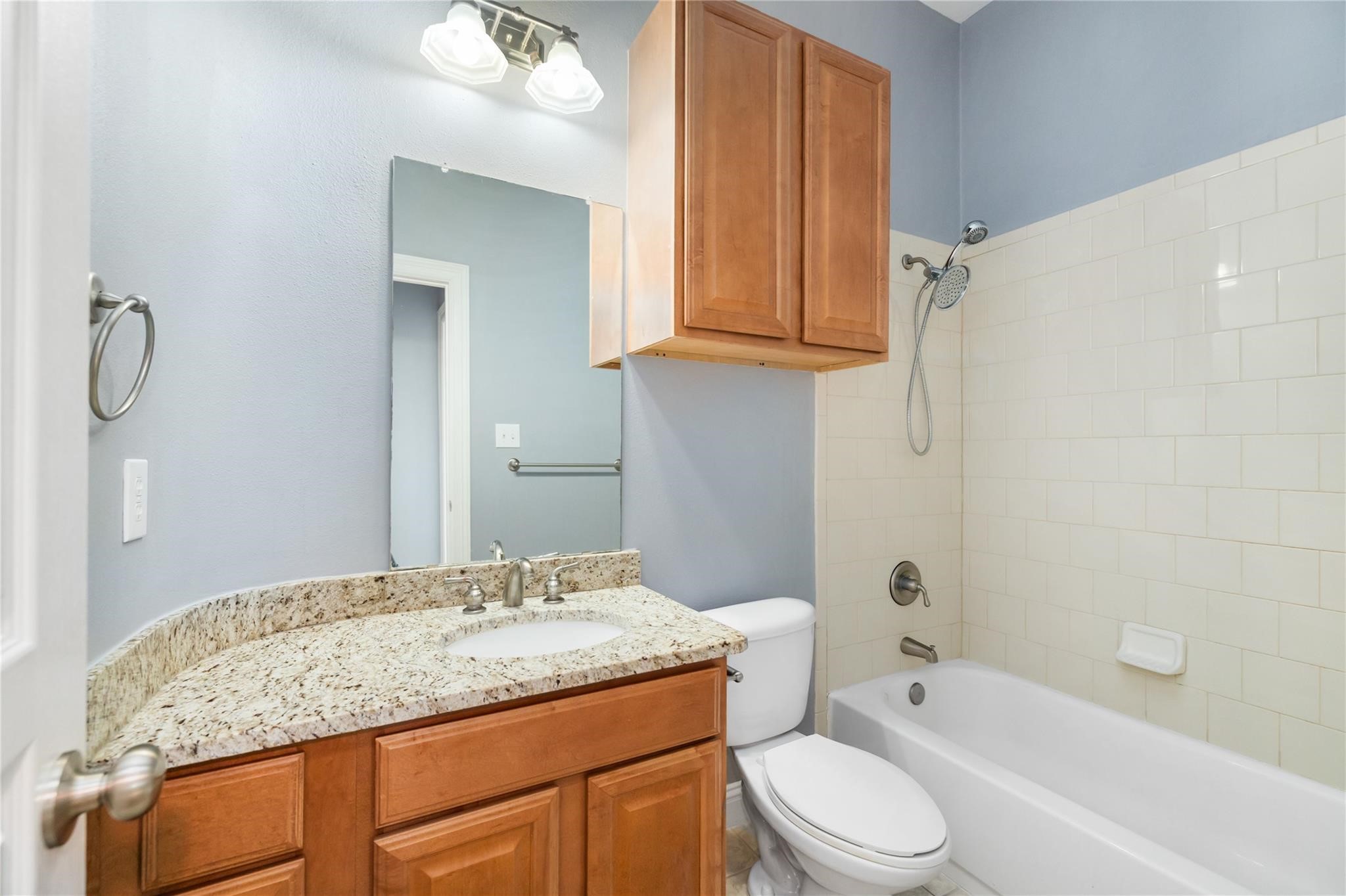 53 Versante Court Houston, TX 77070 - Photo 14 of 30 a bathroom with a granite countertop sink toilet and shower