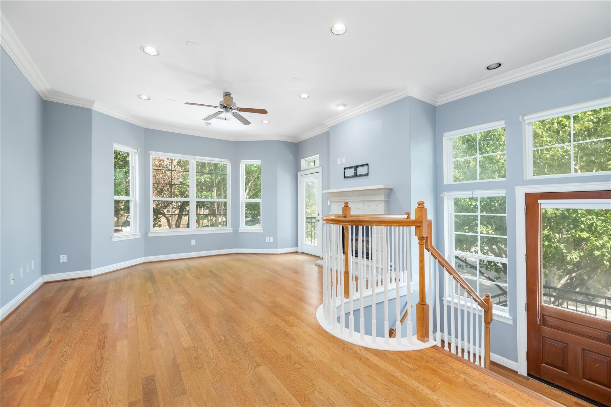53 Versante Court Houston, TX 77070 - Photo 6 of 30 a view of a room with wooden floor fan and windows
