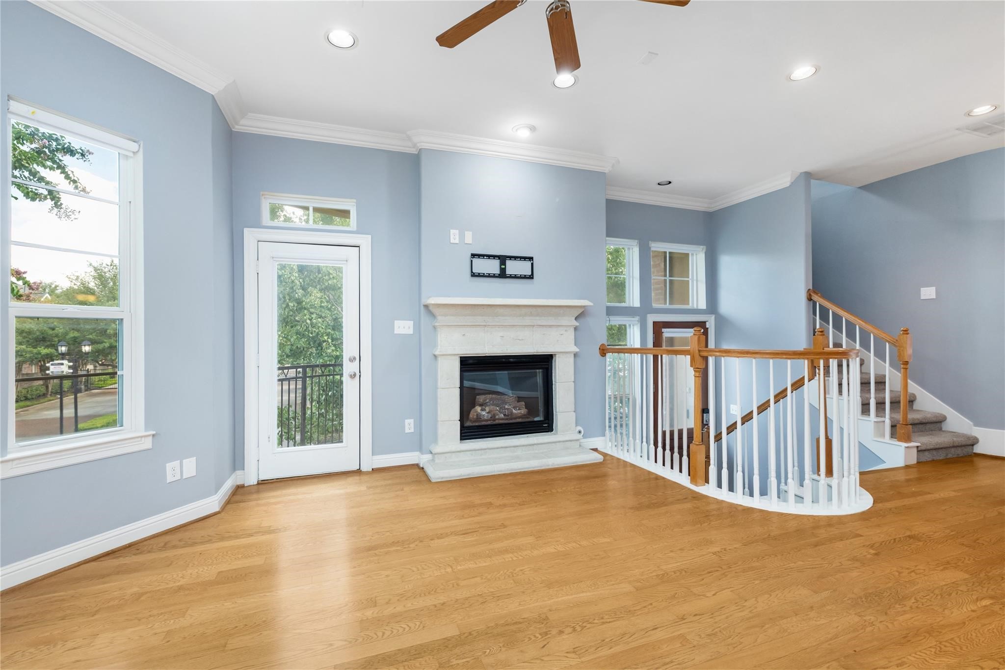 53 Versante Court Houston, TX 77070 - Photo 7 of 30 a view of an empty room with a fireplace and a window