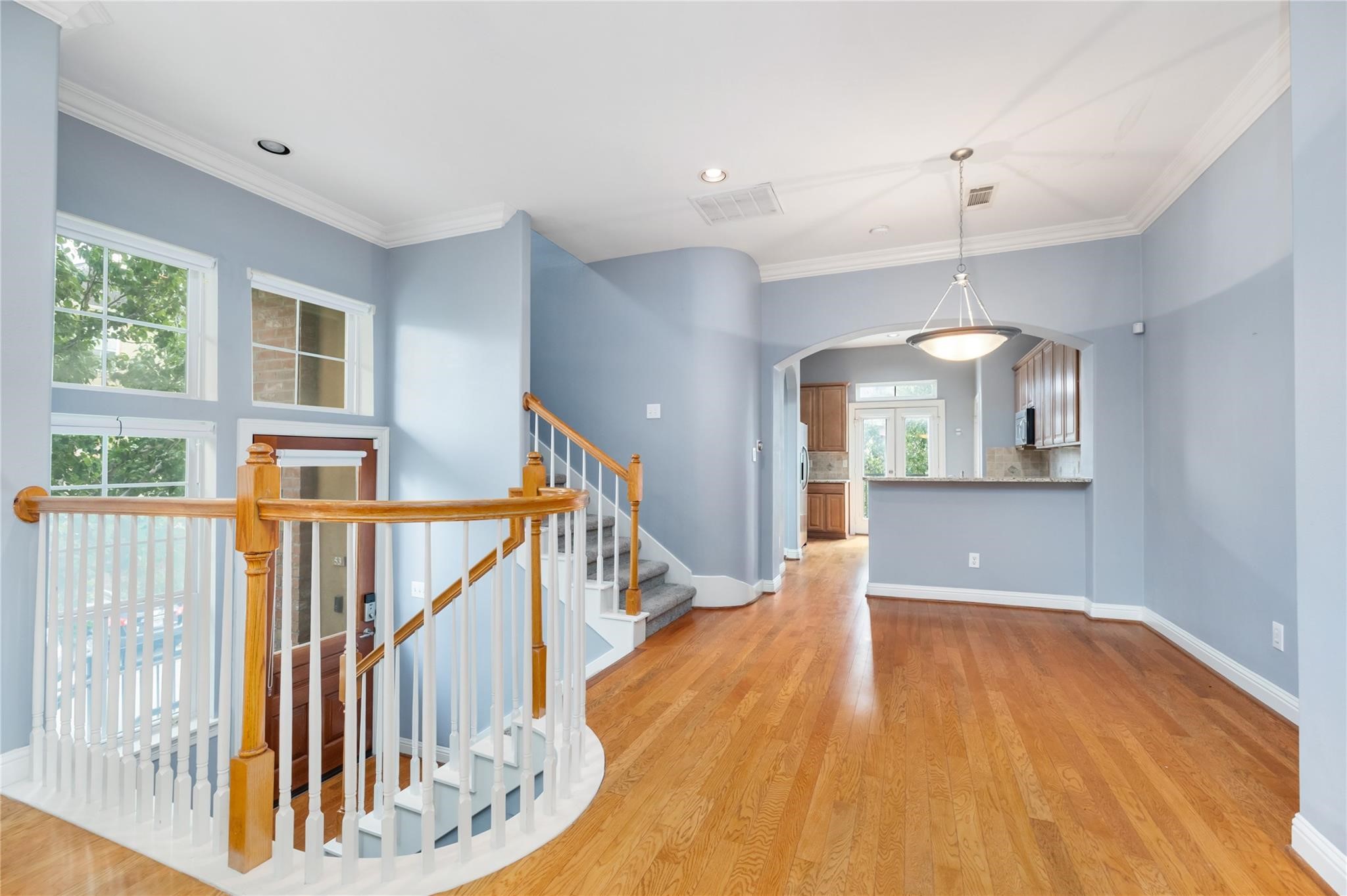 53 Versante Court Houston, TX 77070 - Photo 9 of 30 a view of entryway and hall with wooden floor