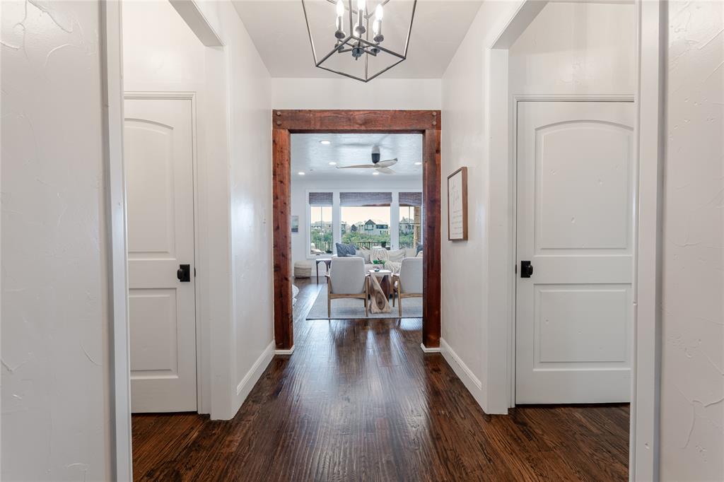 1653 Scenic Drive, Unit 102 Graford, TX 76449 - Photo 1 of 35 a view of a hallway view with wooden floor and staircase