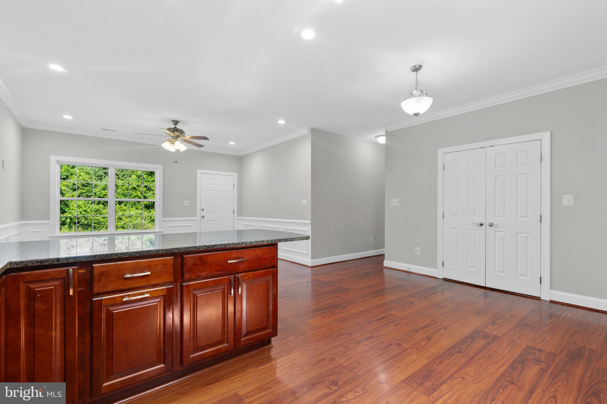 16665 Three Notch Road Ridge, MD 20680 - Photo 14 of 38 a view of kitchen with wooden floor and window