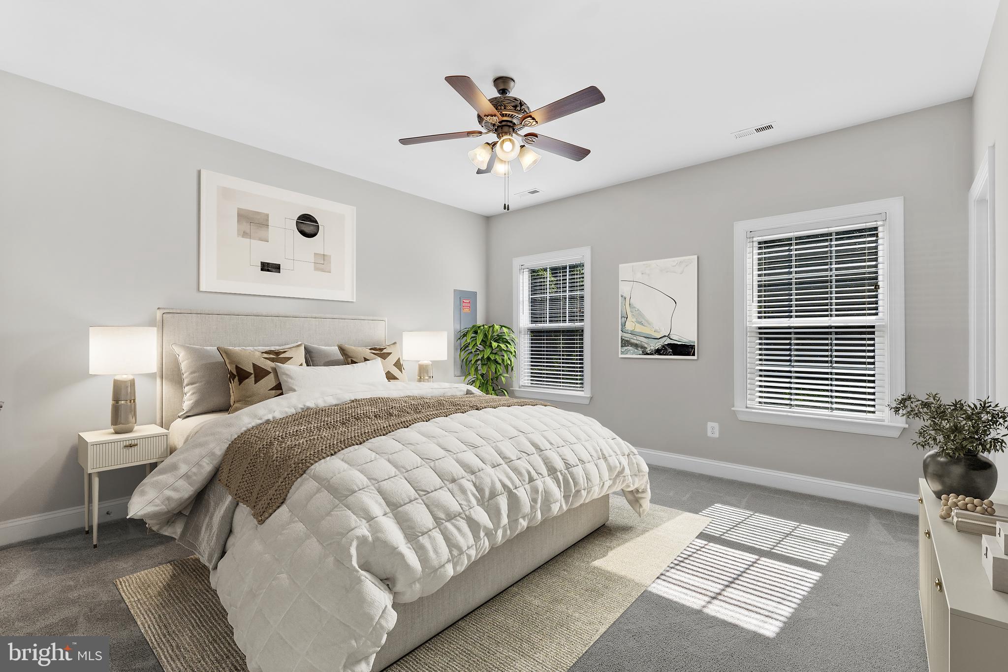 16665 Three Notch Road Ridge, MD 20680 - Photo 16 of 38 a bedroom with a large bed and a window