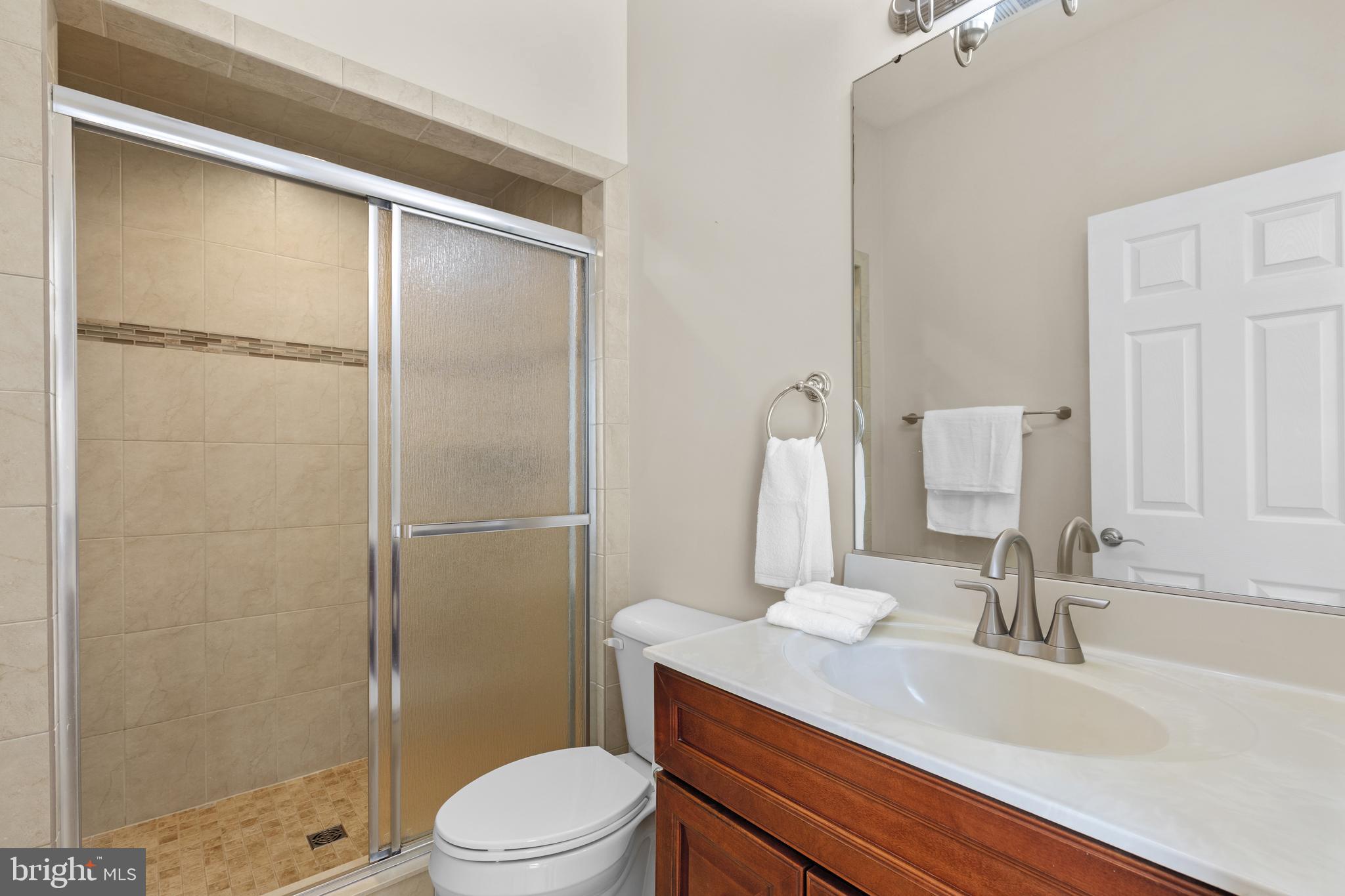 16665 Three Notch Road Ridge, MD 20680 - Photo 19 of 38 a bathroom with a sink toilet and shower