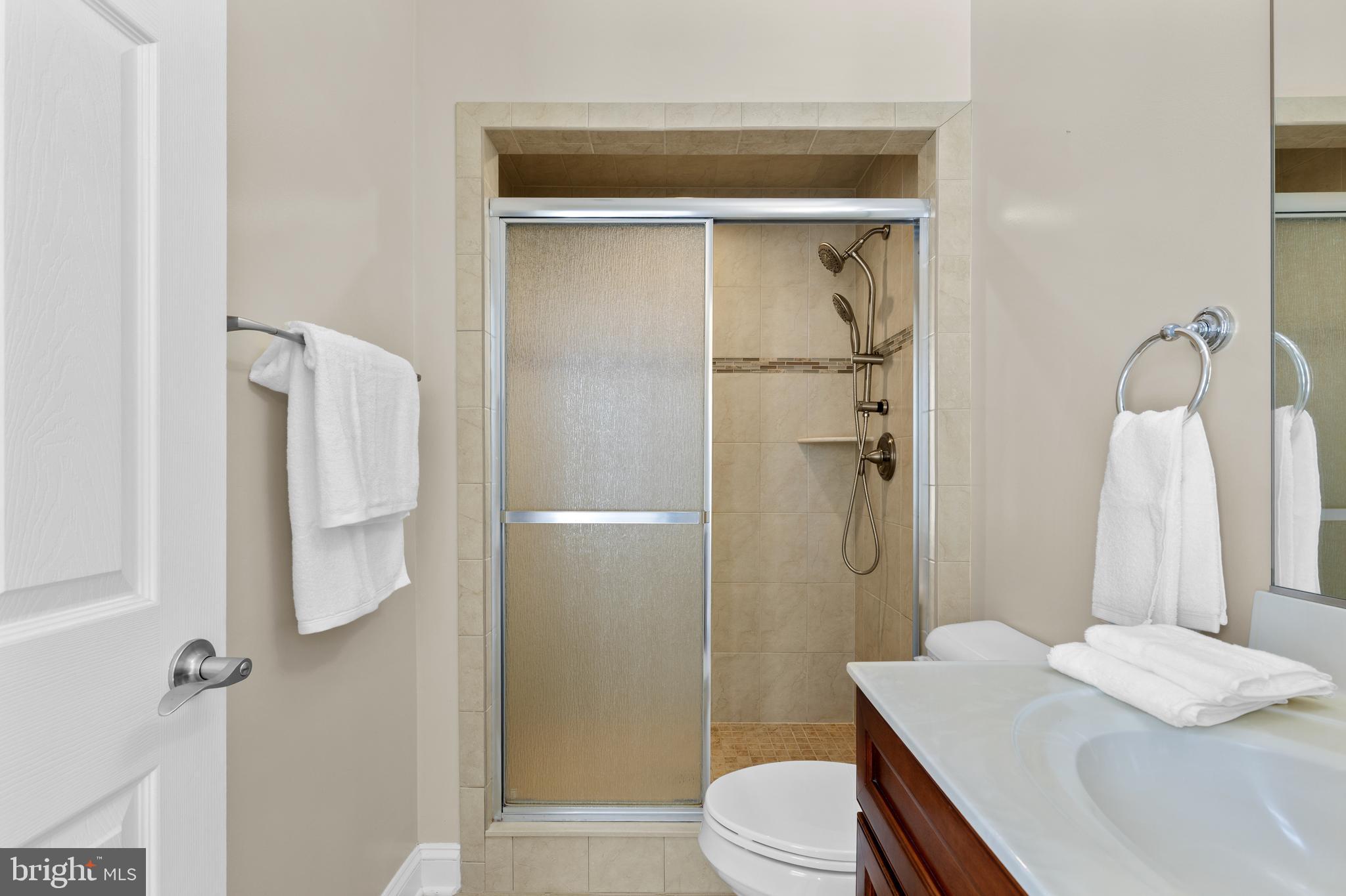 16665 Three Notch Road Ridge, MD 20680 - Photo 20 of 38 a bathroom with a sink toilet and shower