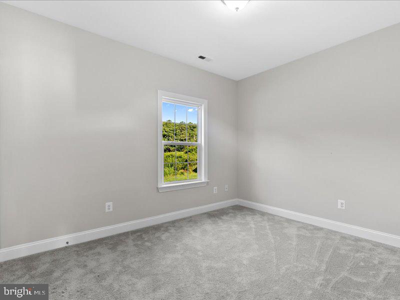 16665 Three Notch Road Ridge, MD 20680 - Photo 21 of 38 an empty room with a window