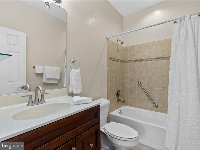 16665 Three Notch Road Ridge, MD 20680 - Photo 23 of 38 a bathroom with a sink a toilet and shower