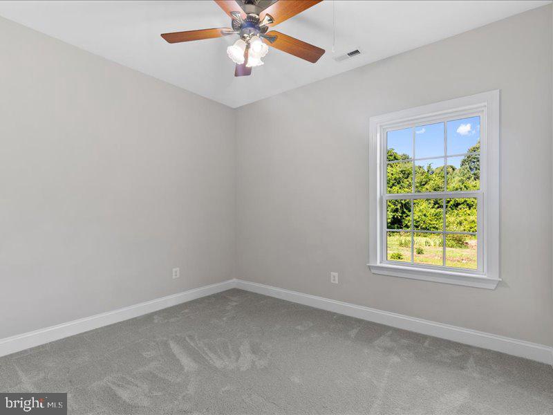 16665 Three Notch Road Ridge, MD 20680 - Photo 24 of 38 an empty room with a window