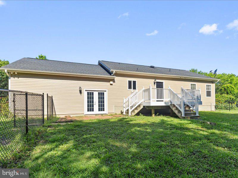 16665 Three Notch Road Ridge, MD 20680 - Photo 33 of 38 a backyard of a house with table and chairs