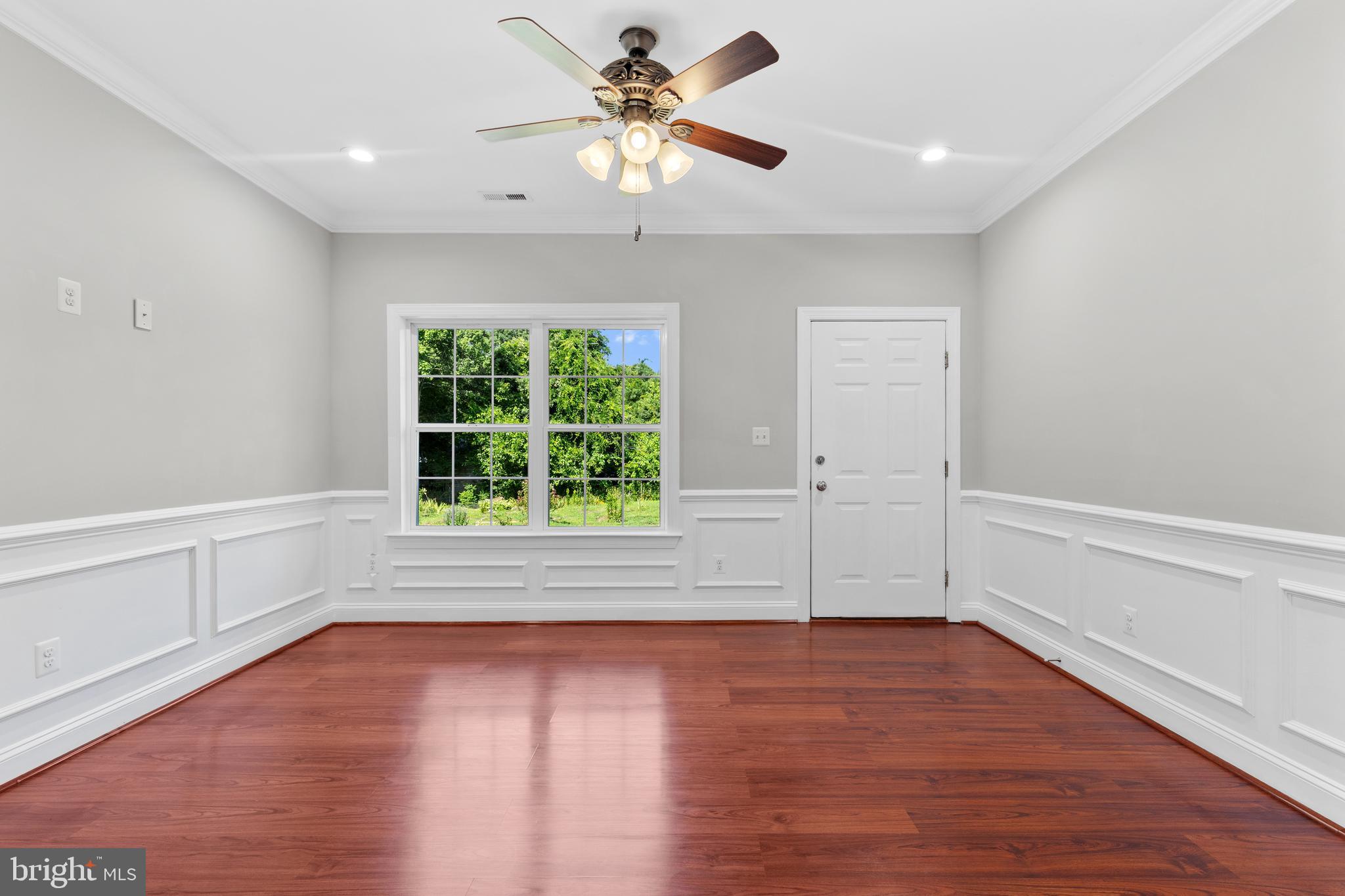 16665 Three Notch Road Ridge, MD 20680 - Photo 7 of 38 wooden floor in an empty room with a window