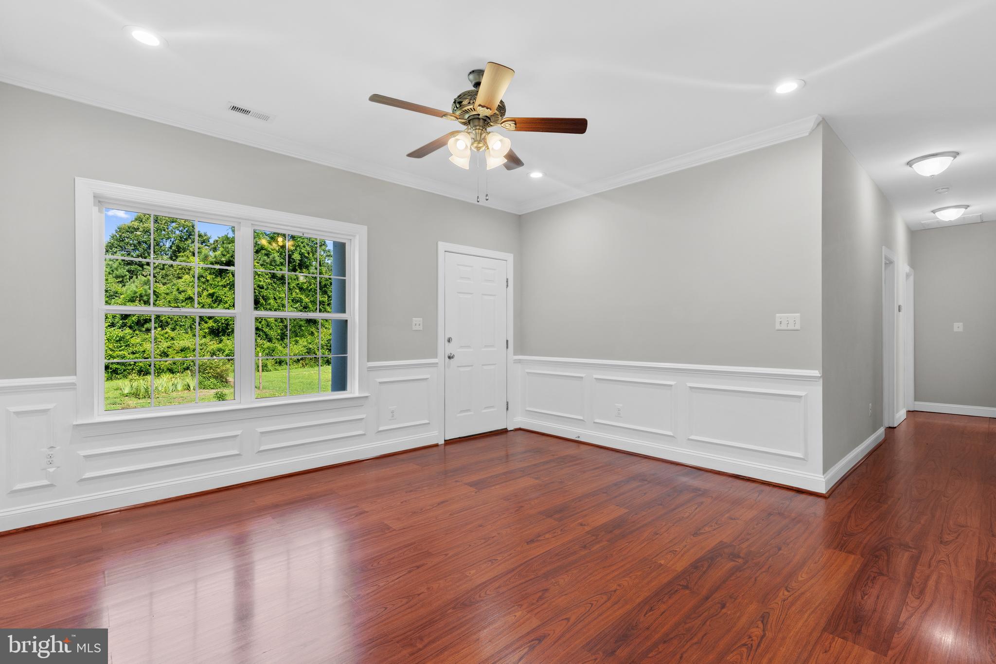 16665 Three Notch Road Ridge, MD 20680 - Photo 8 of 38 wooden floor in an empty room with a window