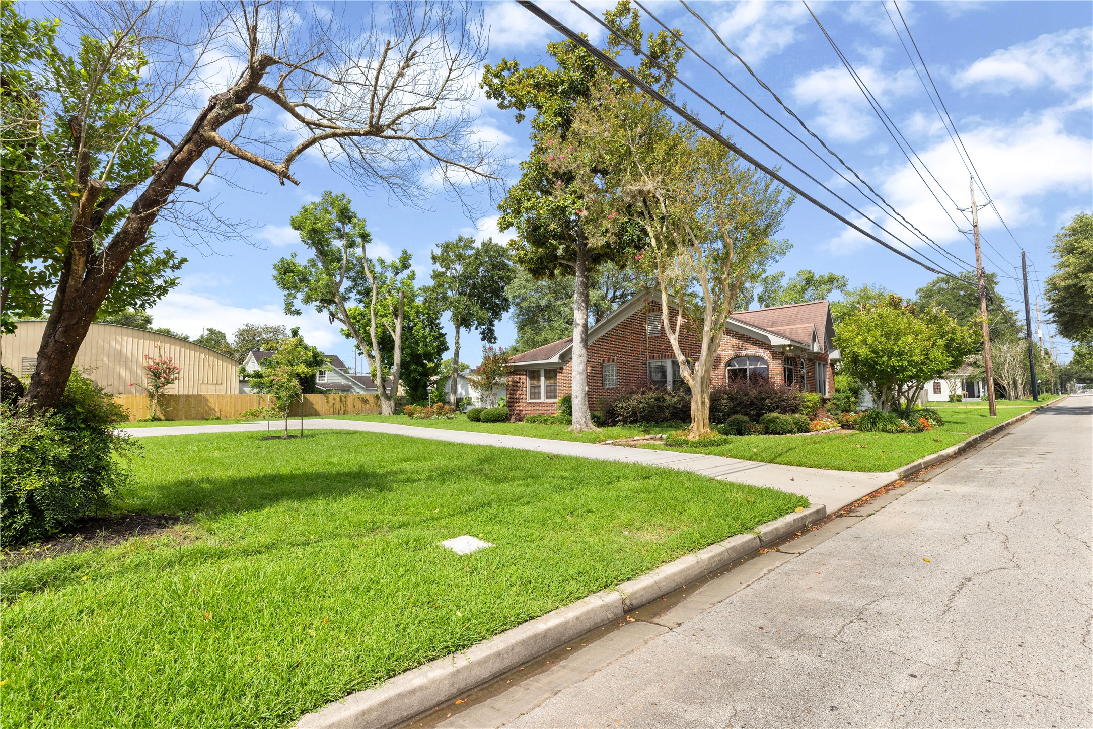 906 Higgins Street Humble, TX 77338 - Photo 3 of 26 This property is located on a quiet street with a sidewalk, offering a spacious front yard, great parking and inviting curb appeal.