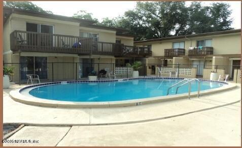 6916 Old Kings Road South Jacksonville, FL 32217 - Photo 3 of 9 a view of backyard with swimming pool and seating space