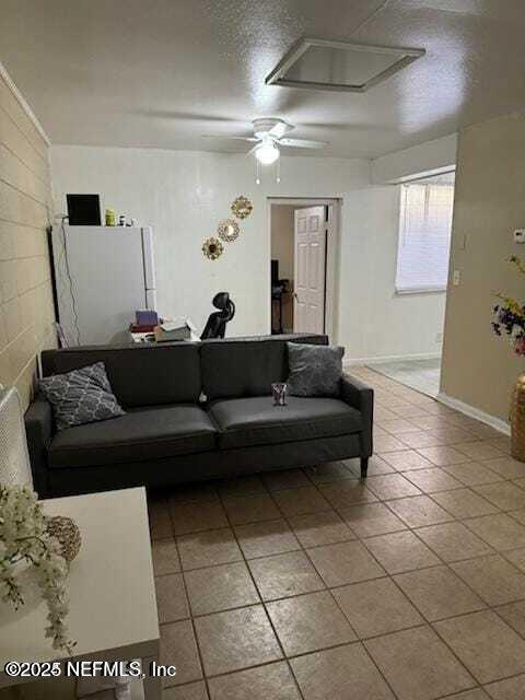 6916 Old Kings Road South Jacksonville, FL 32217 - Photo 4 of 9 a living room with a couch and a potted plant