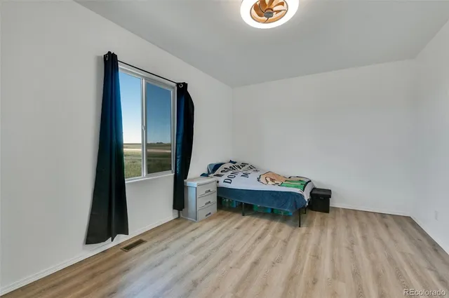 a room with a bed and a window