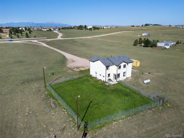 a view of a lake with houses in the back