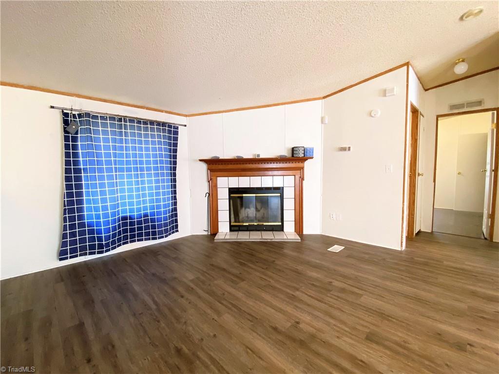 275 Reginald Road Mayodan, NC 27027 - Photo 6 of 43 Den fireplace