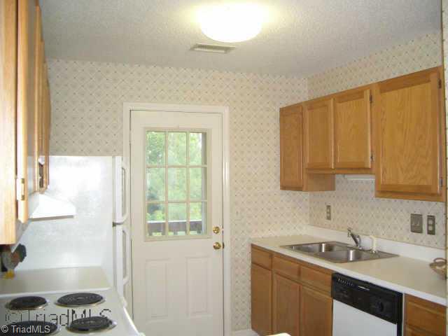 Other. The kitchen has attractive oak cabinets, built-in oven, dishwasher and disposal.