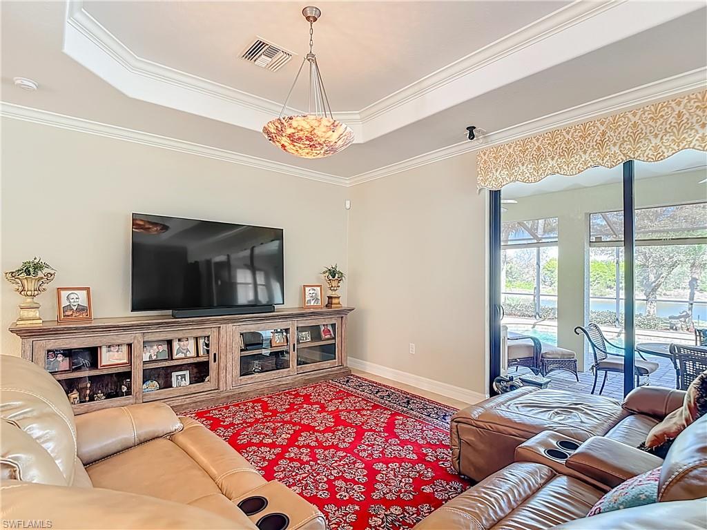 9250 Veneto Place Naples, FL 34113 - Photo 15 of 50 a living room with furniture and a flat screen tv