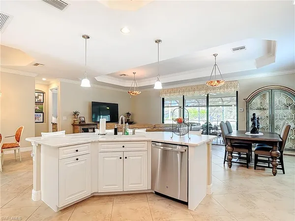 a view of a kitchen and dining room