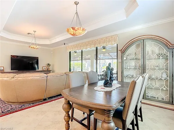 a view of a dining room with furniture window and outside view