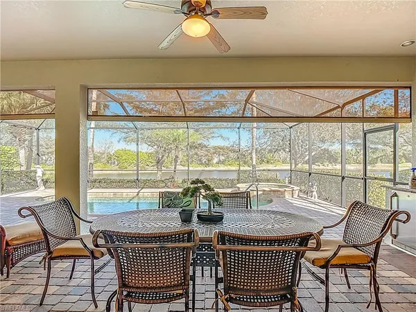 a view of a dining room with furniture window and outside view